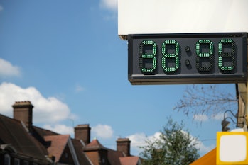 
A digital thermometer in London showing the temperatures during the UK heat wave. It reads 38  °C (...
