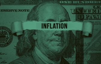 Torn bills revealing Inflation words. Idea for FED consider interest rate hike, world economics and ...