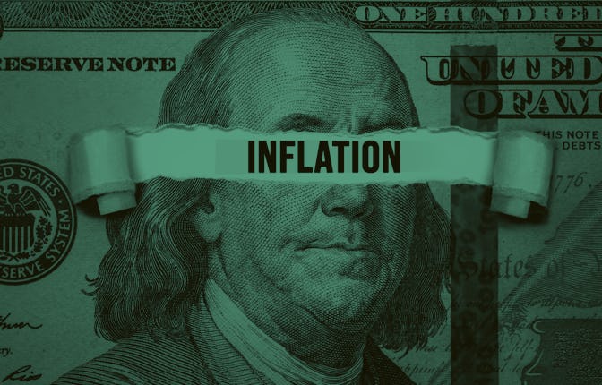 Torn bills revealing Inflation words. Idea for FED consider interest rate hike, world economics and ...