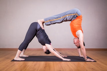 Double downward dog - Couples Yoga: 5 Yoga poses to strengthen