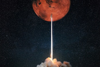 Rocket with blast and smoke takes off to the red planet mars. Mars concept. Spacecraft lift off to e...