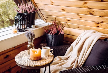 Cute autumn hygge home decor that's serving cottagecore aesthetics. Tiny wooden cabin balcony with h...