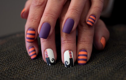Witch shoes and stripes for Halloween nails.