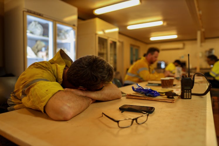 Construction miner having a break naps ,sleep during lunch time after working 12 Hrs night shift in ...