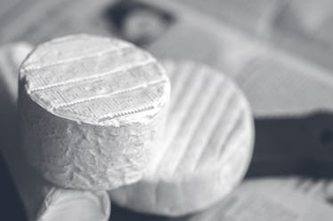 Camembert on board. Cheese for advertising. For a large board. Bree from the oven. Cheese baked in t...