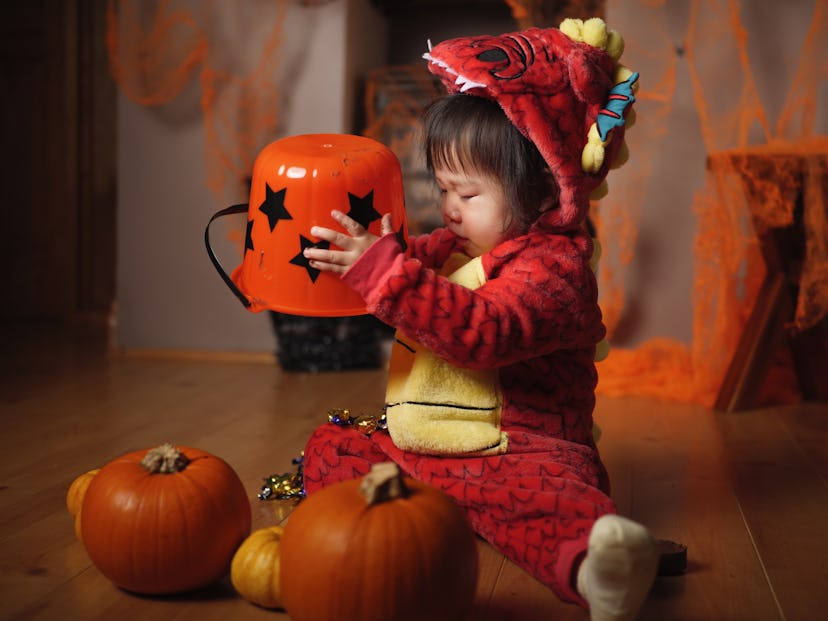 Baby girl celebrating her first halloween party in an article about baby's first halloween instagram...