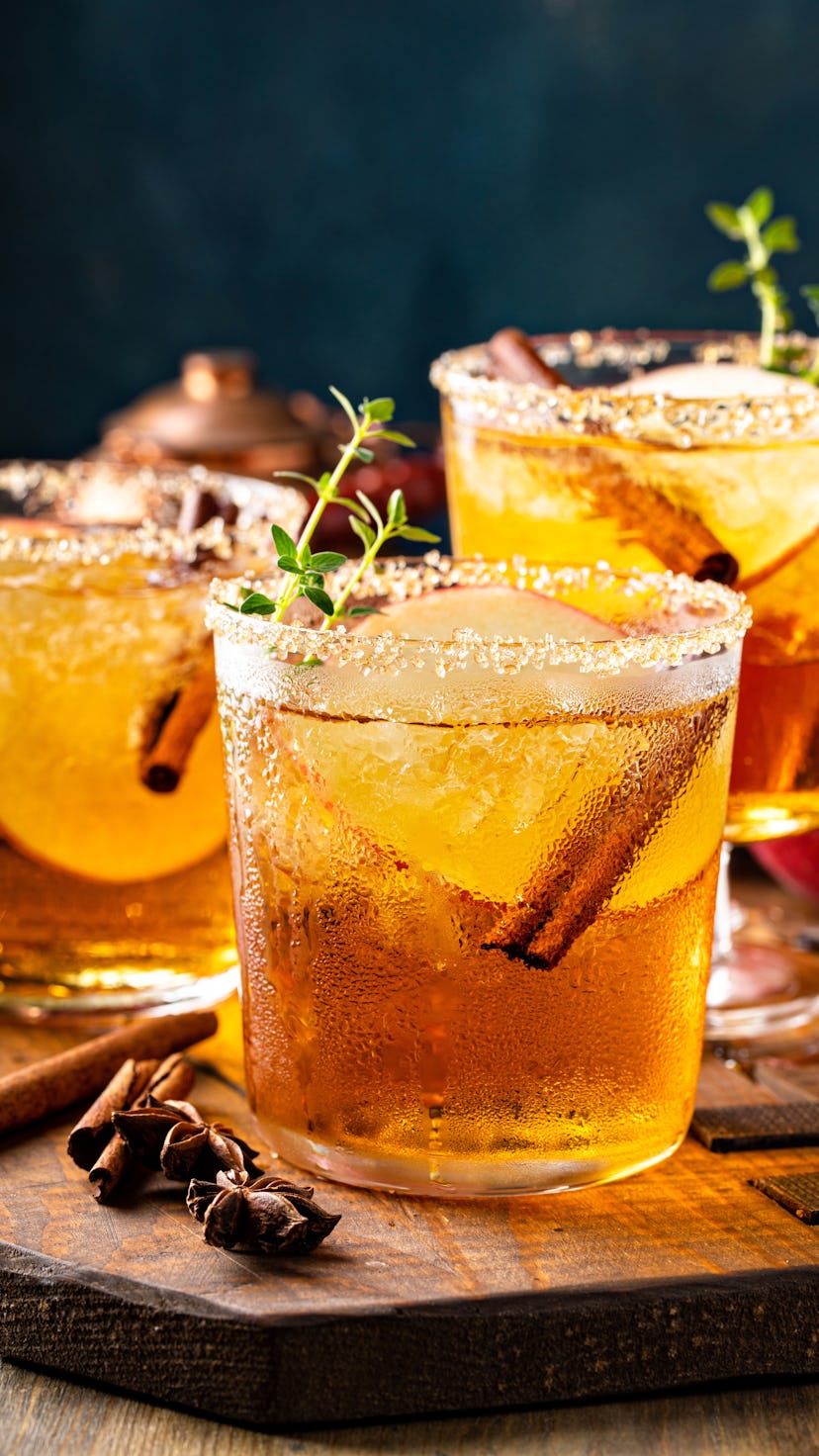 Apple cider margarita with brown sugar rim, cinnamon and fresh thyme, a Thanksgiving cocktail idea.