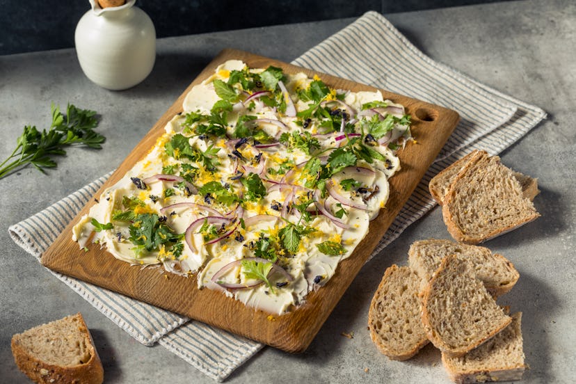 Homemade Trendy Butter Board with Herbs and Bread