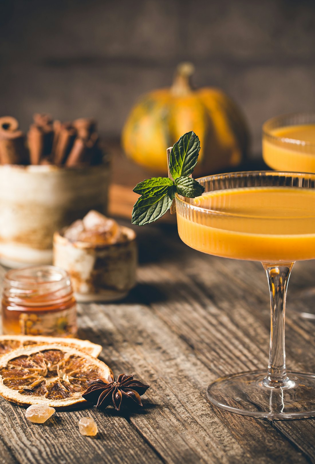 Pumpkin and orange spiced Thanksgiving cocktail with cinnamon.