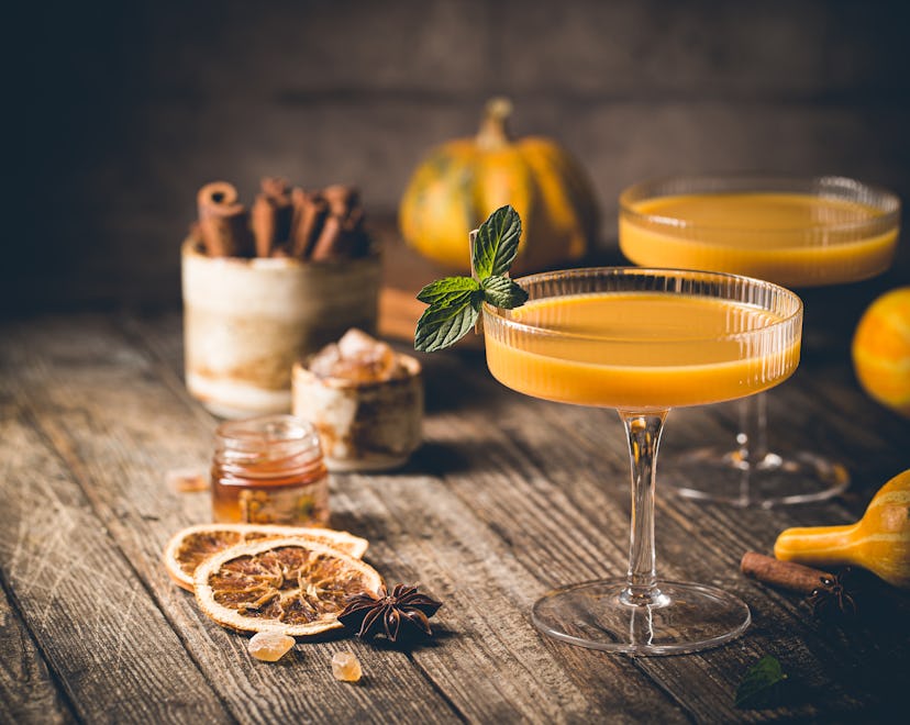 Pumpkin and orange spiced Thanksgiving cocktail with cinnamon.