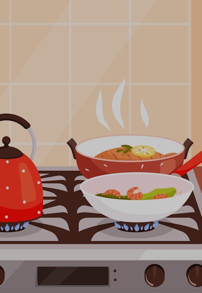 Kitchen cooking. Boiling in pans on gas stove burning and steam from preparing food delicious cuisin...