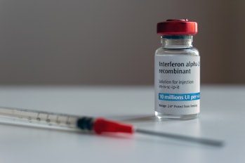Bottle of interferon alpha 2b and syringe (artistic rendering)