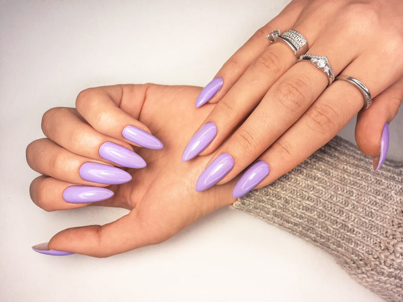 A Digital Lavender manicure trend as seen on long, almond-shaped nails.