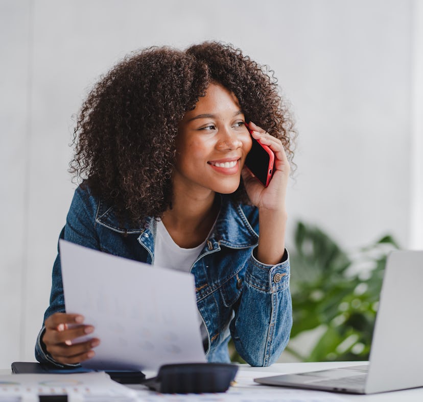 african american businesswoman talking on the phone girl working in the office