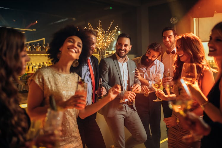 Group of coworkers at the office use holiday party captions.