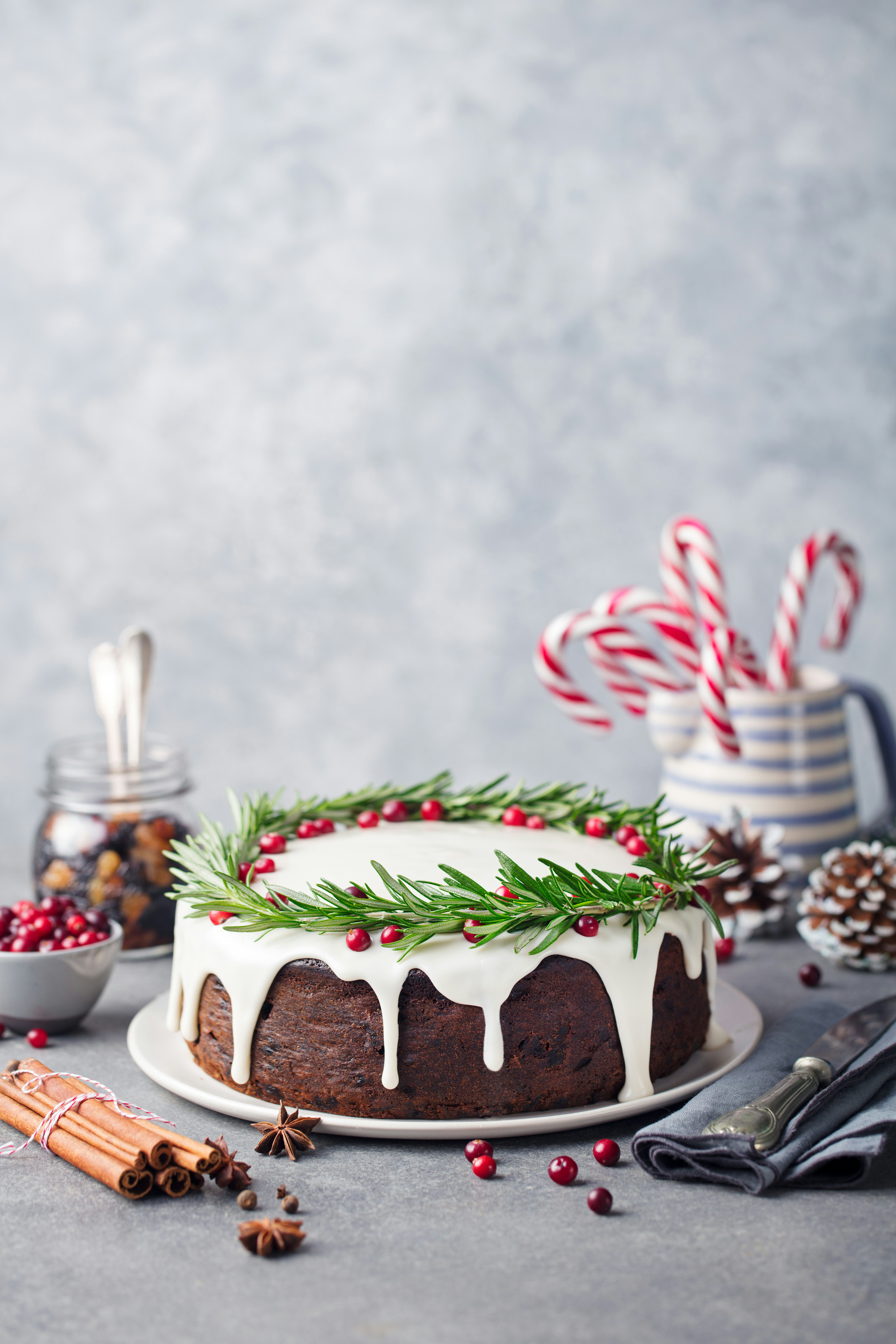 Christmas fruit cake, pudding on white plate. Copy space.