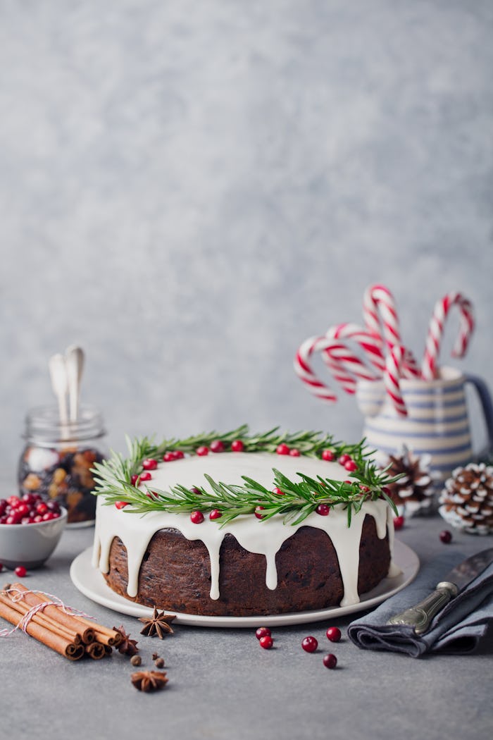 Christmas fruit cake, pudding on white plate. Copy space.
