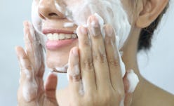 Close up of Asian woman washing face