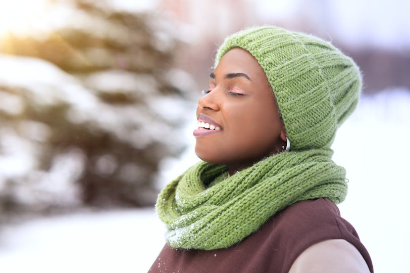 Portrait of beautiful attractive happy girl young black African Afro American woman is enjoying good...