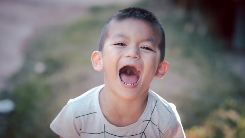 A little boy smiling at the camera. Boy names that mean love include "Prem," which come from Sanskri...