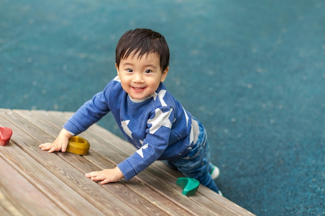 Asian boy is playing in playground with happy face in summer. Boy names that start with J include Jo...