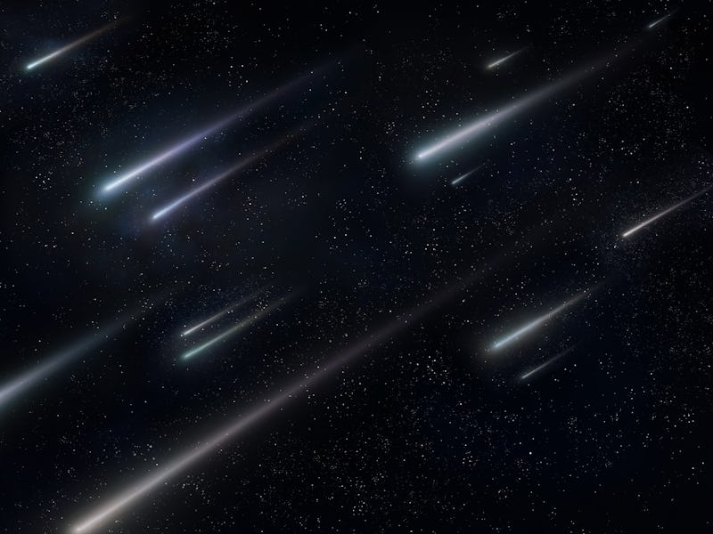 Star rain in the night sky. Falling stars on a black background. Beautiful meteor shower, falling me...