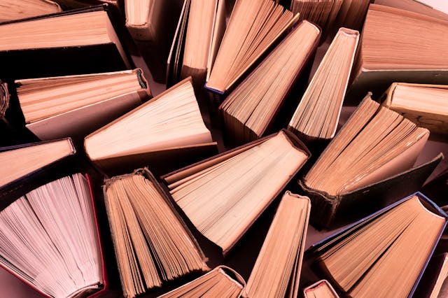 Book background. Old books in the library. Bookshelf shop. Knowledge publications, literature. Booki...