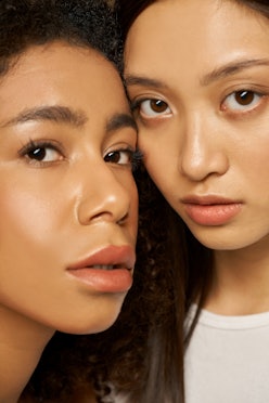 Face closeup of two women with glowing skin. 