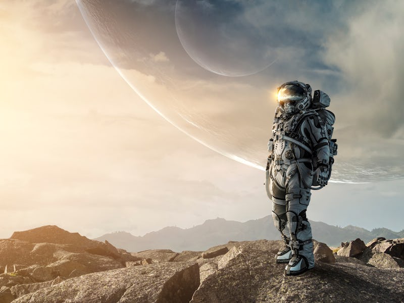 Astronaut walking on an unexplored planet . Mixed media