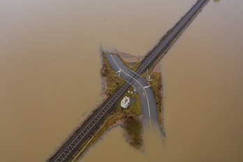 Flooding Germany .Flooded road passing through the railway. A road under water. 