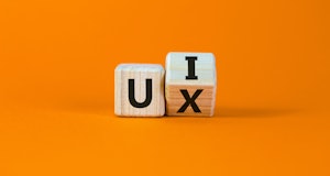 UX design or UI design. Turned cube and changed the words 'UX' to 'UI'. Beautiful orange background....
