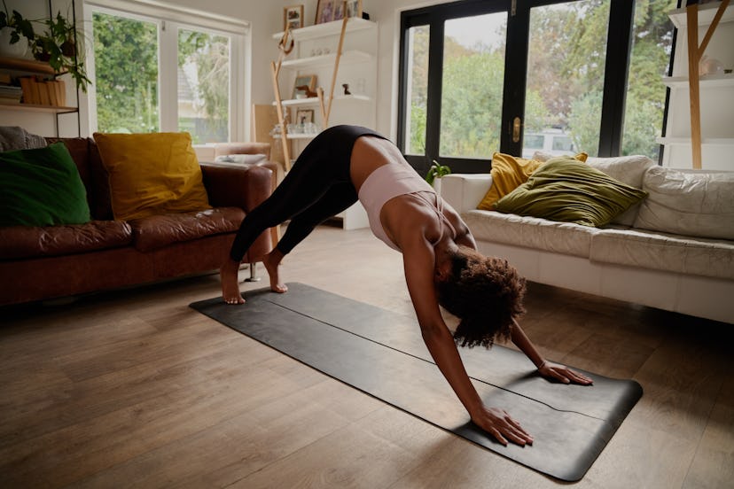 Build up to doing a headstand by practicing weight-bearing yoga moves, like downward facing dog.
