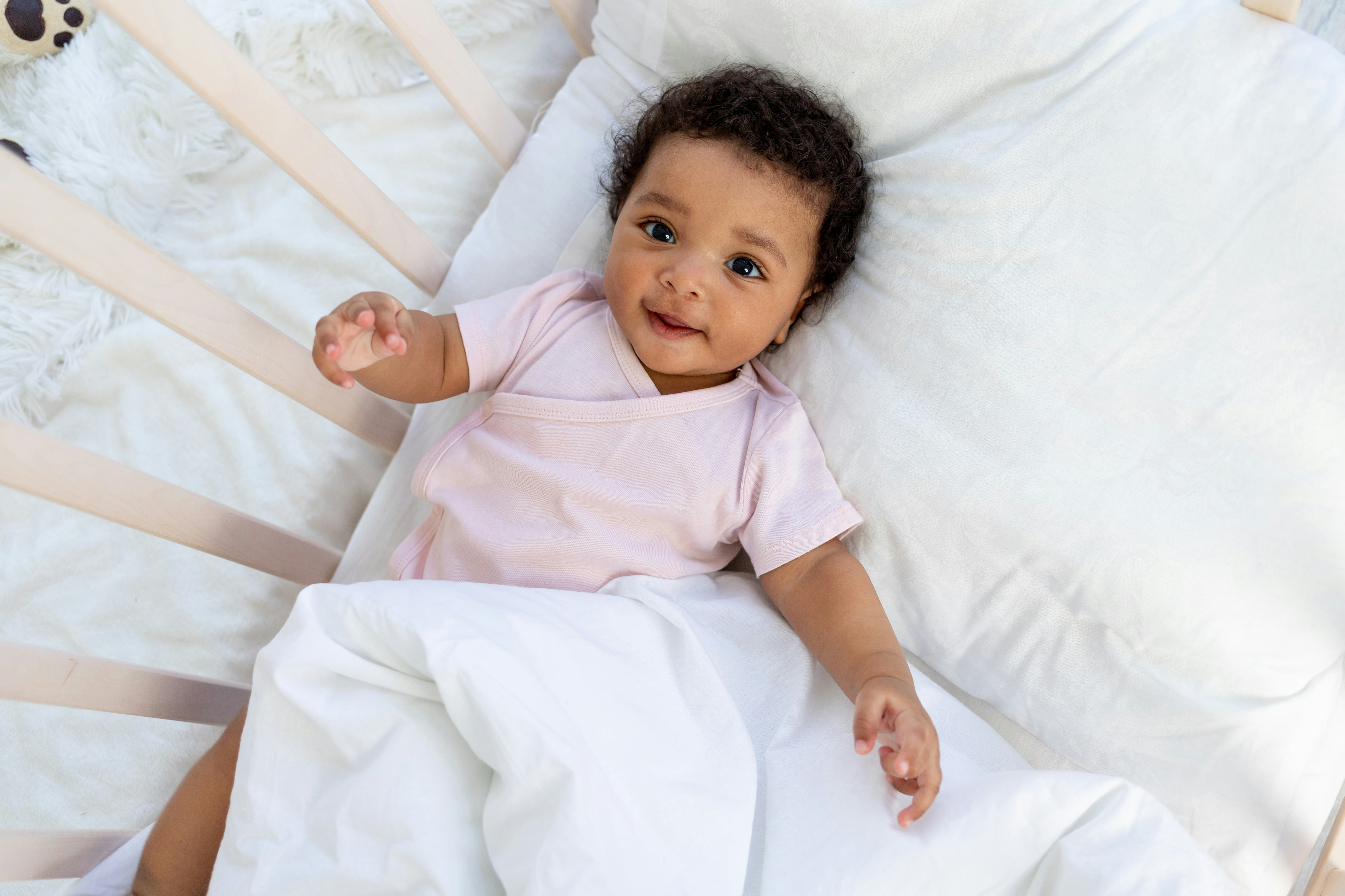 How To Keep Your Baby From Sticking Their Arms & Legs Through The Crib Bars