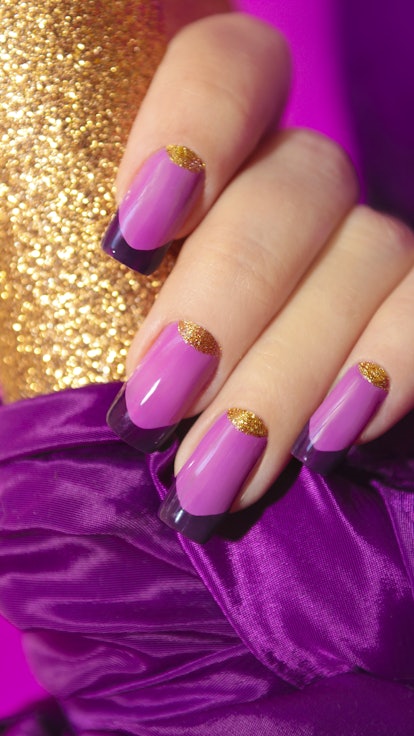 French manicure with deep purple tips, purple base, and a gold detail.