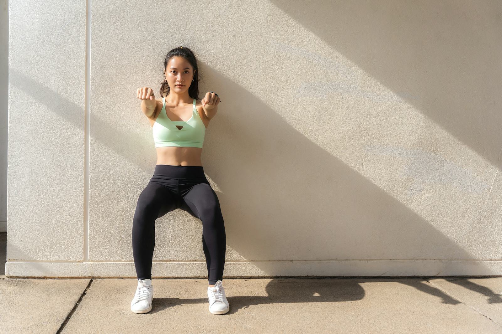 How Long Should You Hold A Wall Sit? Trainers Weigh In