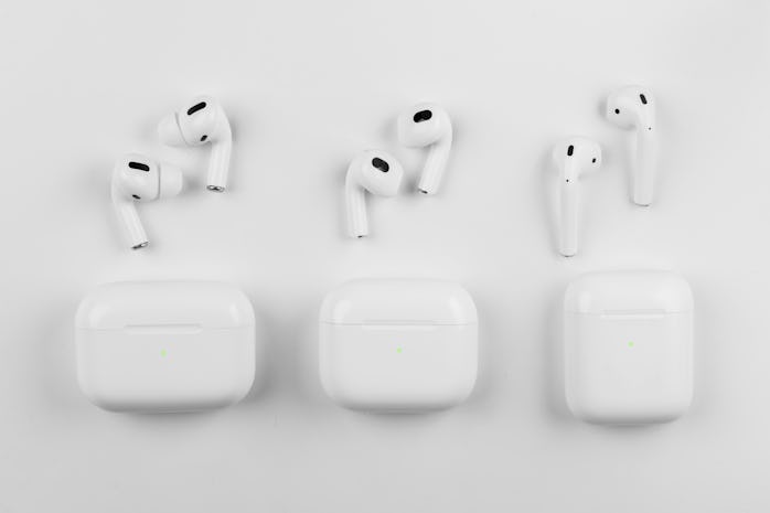 Air Pods 3. Air Pods 2021. with Wireless Charging Case. Magsafe. New Airpods on black background. Ai...
