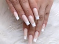Modern French tip design nails. Pink and white nails. Artificial nail art