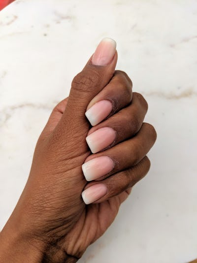 New 'ombre' french manicure nail design. Close up of closed hands and fingers. Elegent, glamorous, s...