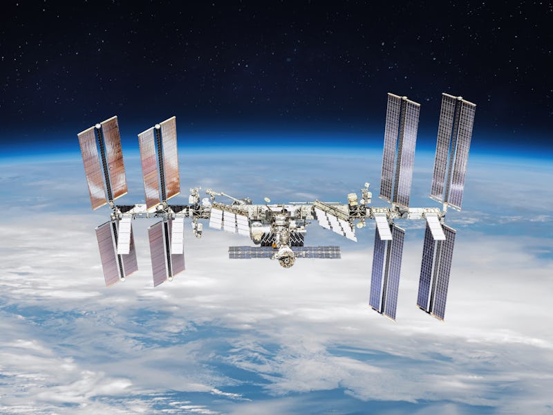 International space station on orbit of the Earth planet. View from outer space.ISS. Earth with clou...