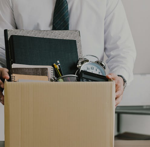 Resignation. businessmen holding boxes for personal belongings and resignation letters.Quitting a jo...