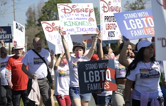 Advocates march at a rally at the Walt Disney Company in Orlando, Fla., spearheaded by advocates fro...