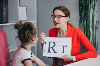 Speech therapist teaches the girls to say the letter R. Female Speech Language Therapist Teaching Pr...