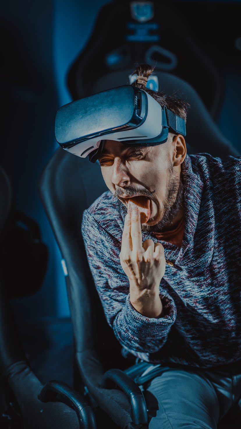 man in virtual glasses is watching a movie in 5d