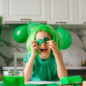 Two toddler boy and girl celebrate the holiday on March 17. Child celebrate St. Patrick's Day. Tradi...