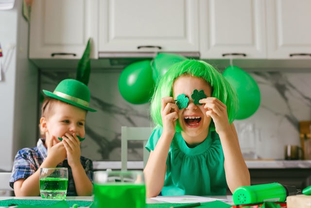 Two toddler boy and girl celebrate the holiday on March 17. Child celebrate St. Patrick's Day. Tradi...