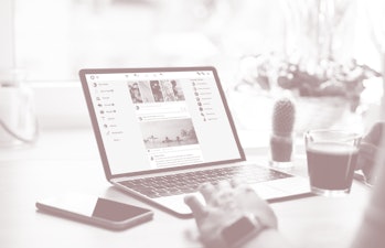 Woman using social media on laptop computer