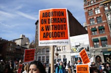 People gather at a rally to protect abortion rights on International Women's Day in Union Square in ...