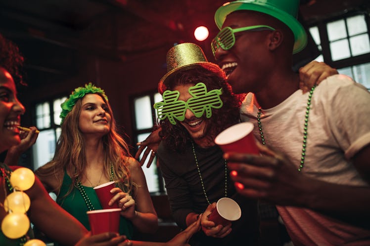 Friends having fun in a bar will need St. Patrick's Day 2022 captions for Instagram pics they take.