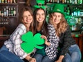 Friends having fun on Saint Patrick's day wearing funny st Patrick's day shirts.