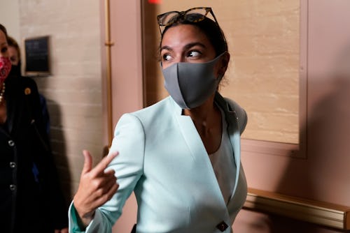 Rep. Alexandria Ocasio-Cortez, D-N.Y., departs after attending a meeting with President Joe Biden an...